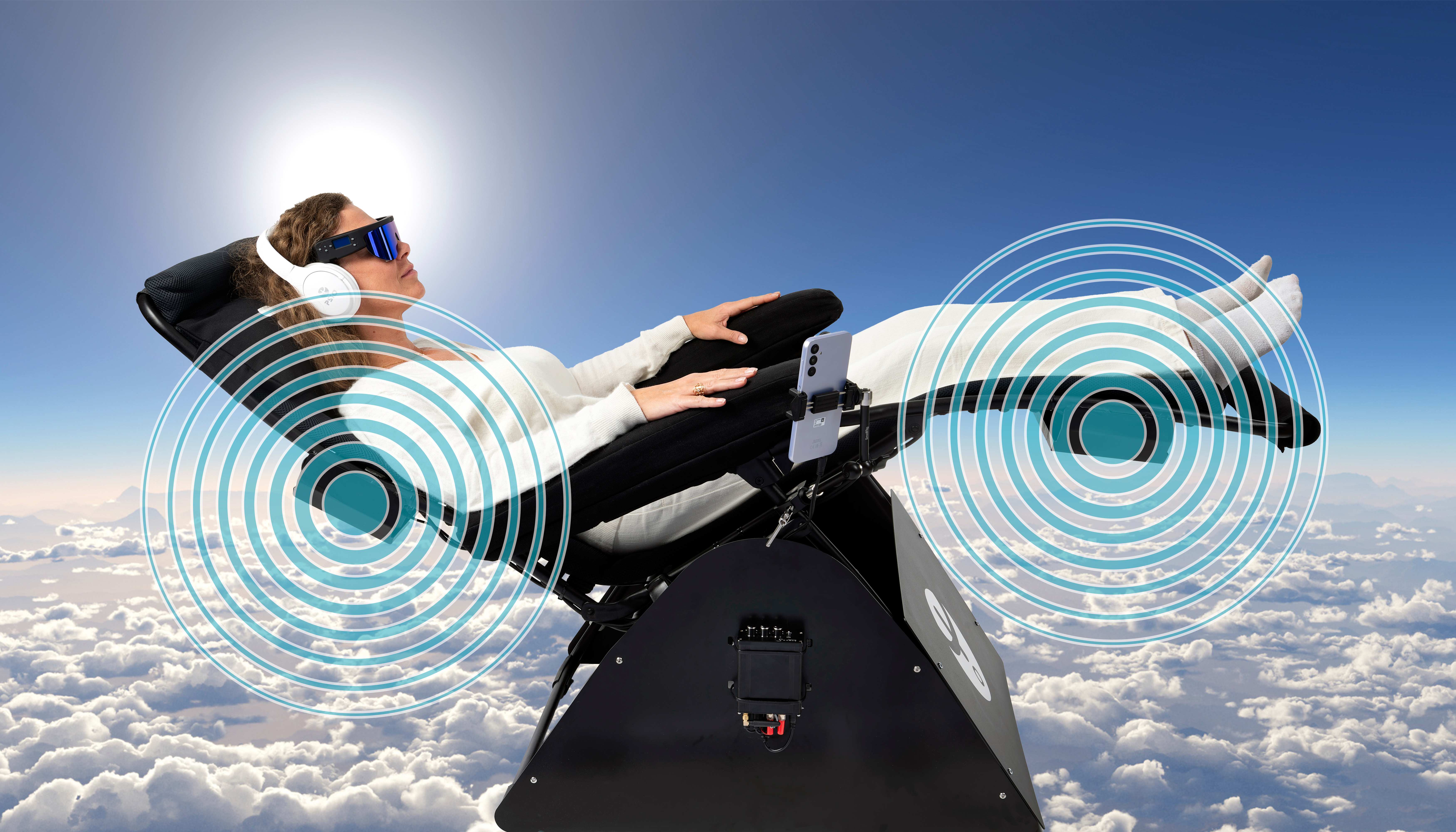 Person relaxing in PSIO wellness chair with light therapy glasses
